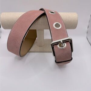 Pink suede belt with silver tone buckle and rivets